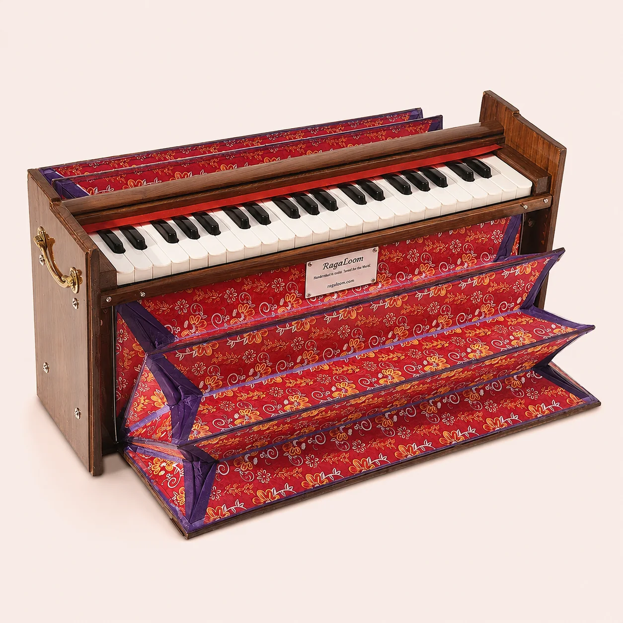 RagaLoom compact Dulcetina harmonium with keyboard and red floral bellows fully open