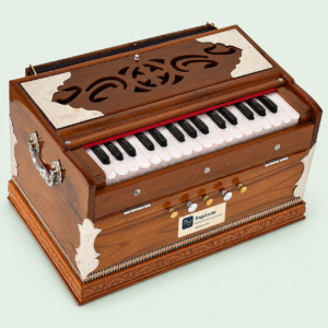 Mini Magic teak harmonium, 32 keys and four stops, front-left angle