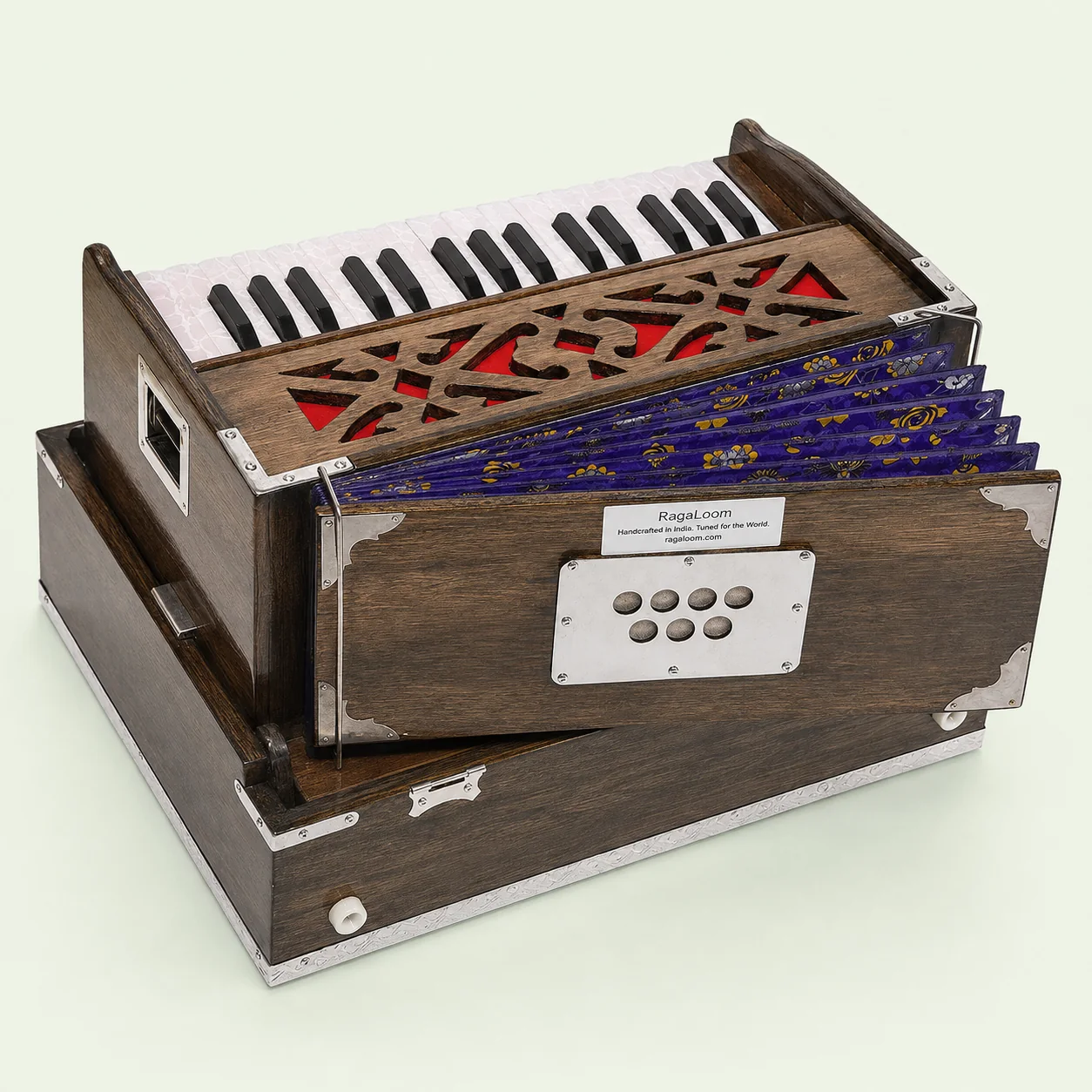 RagaLoom Mini Traveler harmonium with purple floral multi-fold bellows open