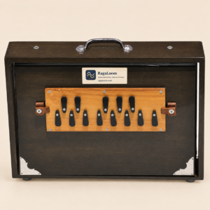 Oak-finish 16-inch wooden shruti box, 13-note front view with RagaLoom label on warm sand background