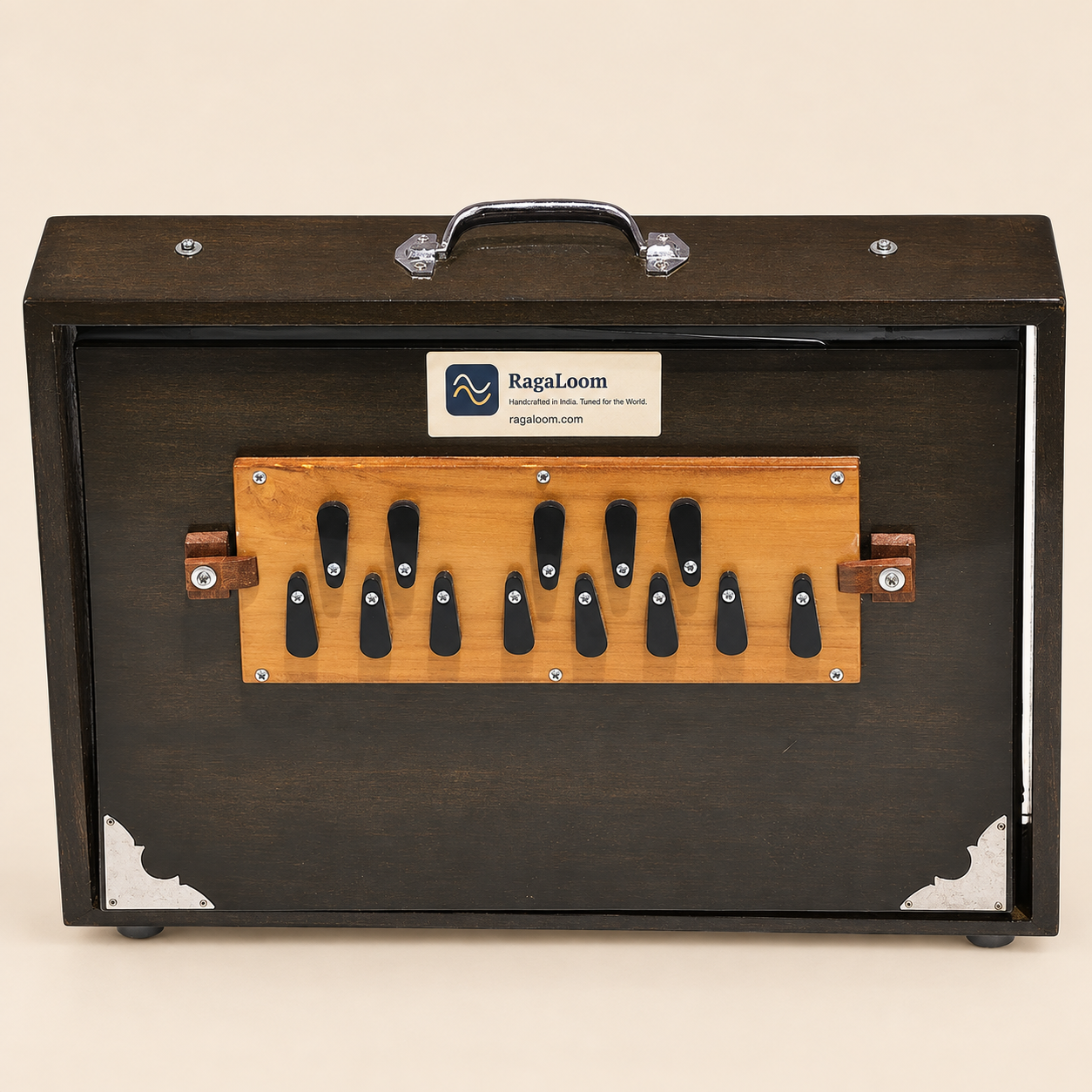 Oak-finish 16-inch wooden shruti box, 13-note front view with RagaLoom label on warm sand background