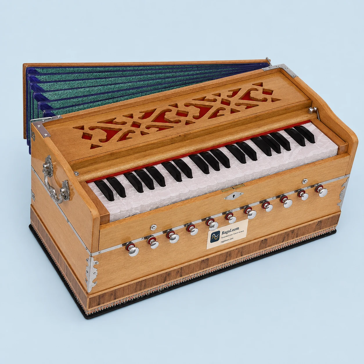 Pro-grade teak harmonium with blue-green bellows, side angle