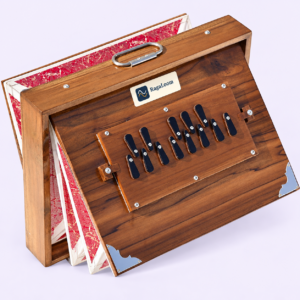 16-inch natural teak shruti box with red patterned bellows open, front angle, RagaLoom label