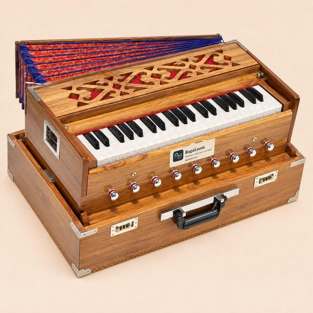 Teak folding traveler harmonium with 9 stops and coupler, front angle