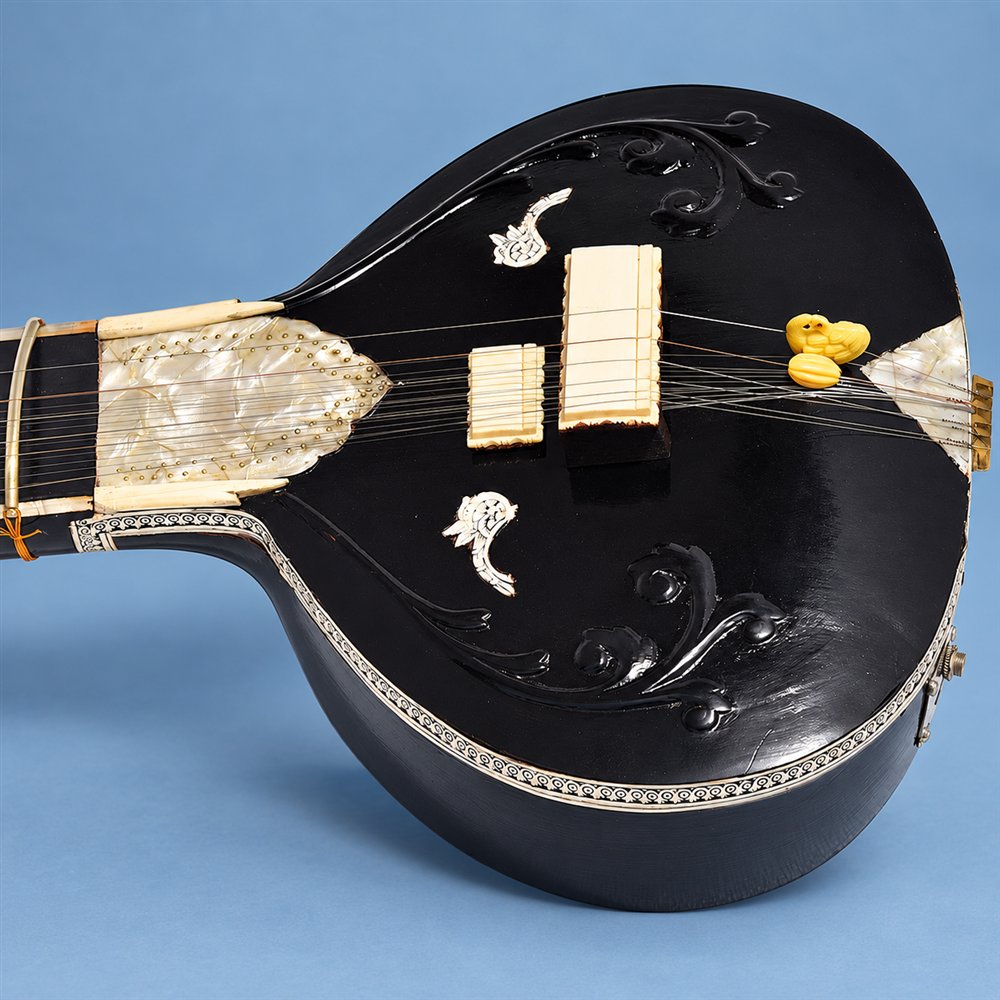 Black Vilayat Khan-style sitar showing main and sympathetic strings