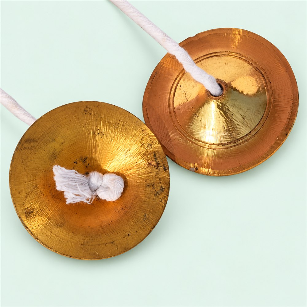 Brass manjira pair showing the handmade reverse surfaces