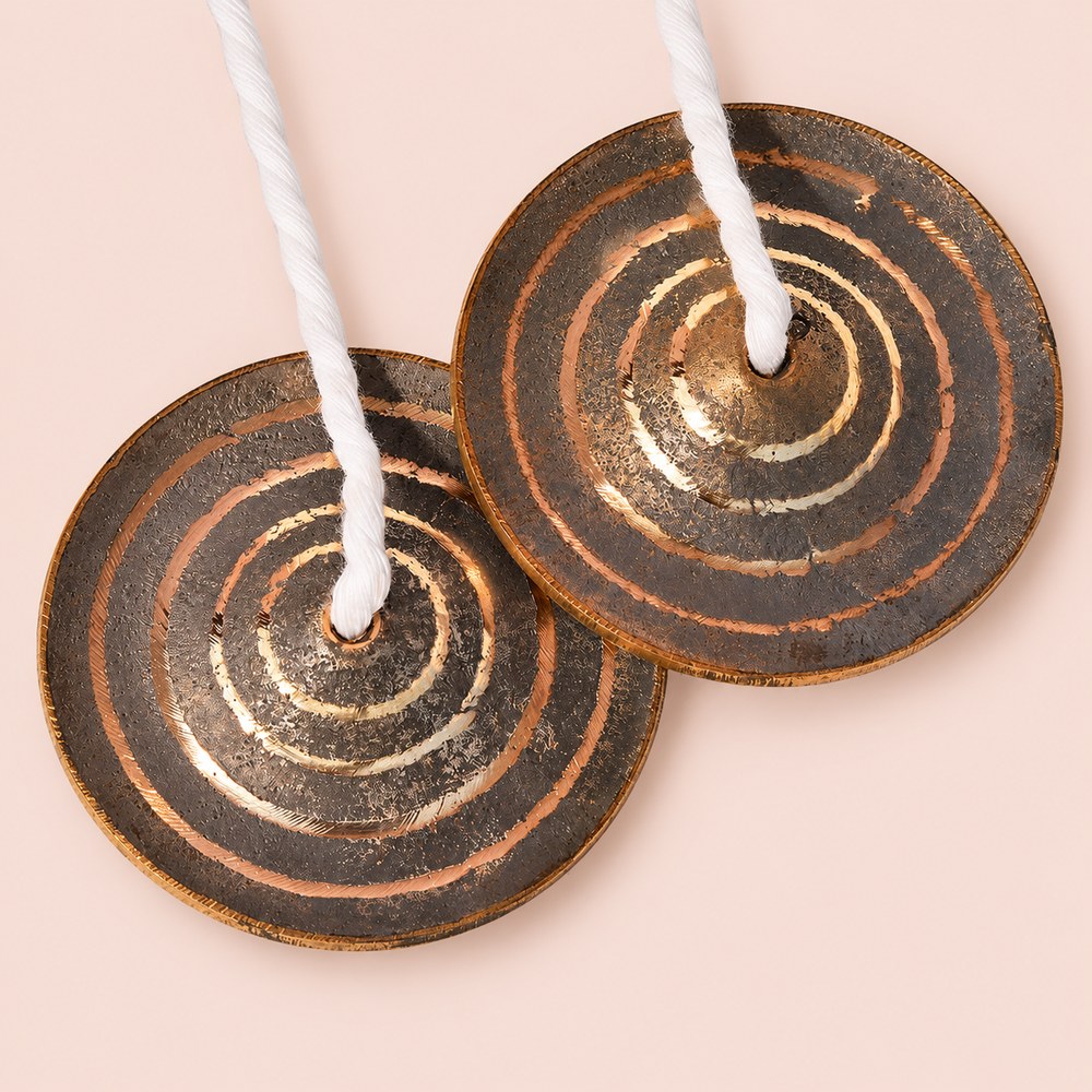 Pair of handcrafted 3.25-inch bronze manjira hand cymbals with cotton cords