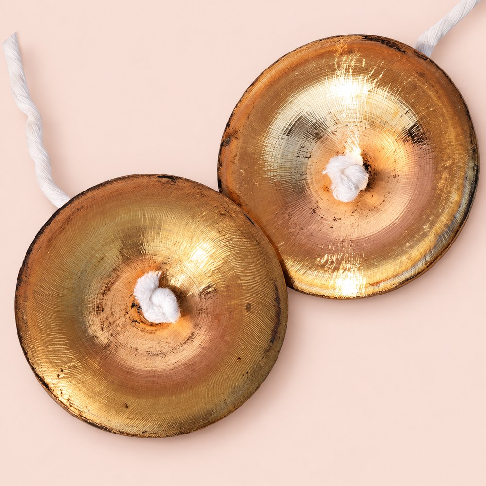 Handcrafted bronze manjira pair, 3.25-inch Indian hand cymbals, detail view