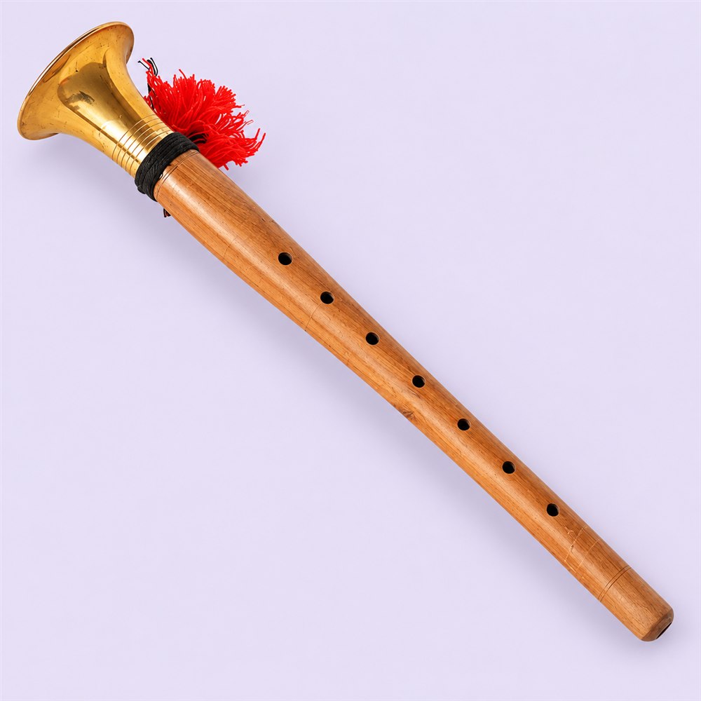 Full-length teak wood shehnai viewed from the side