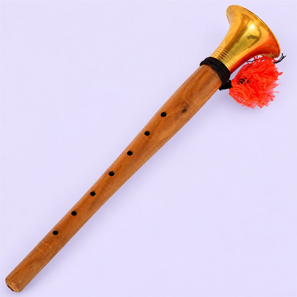 Full-length shehnai showing wood body and flared brass bell
